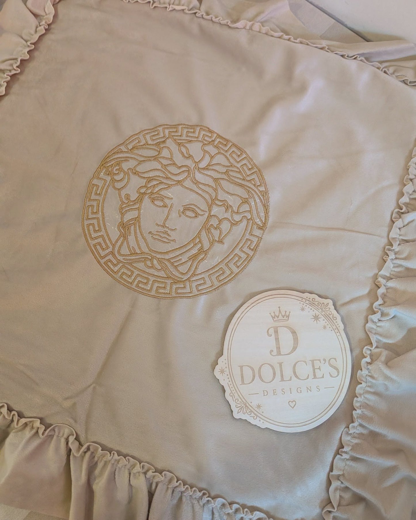 Luxury Gold Emblem Ruffle Cushion Cover – Neutral Embroidered Design