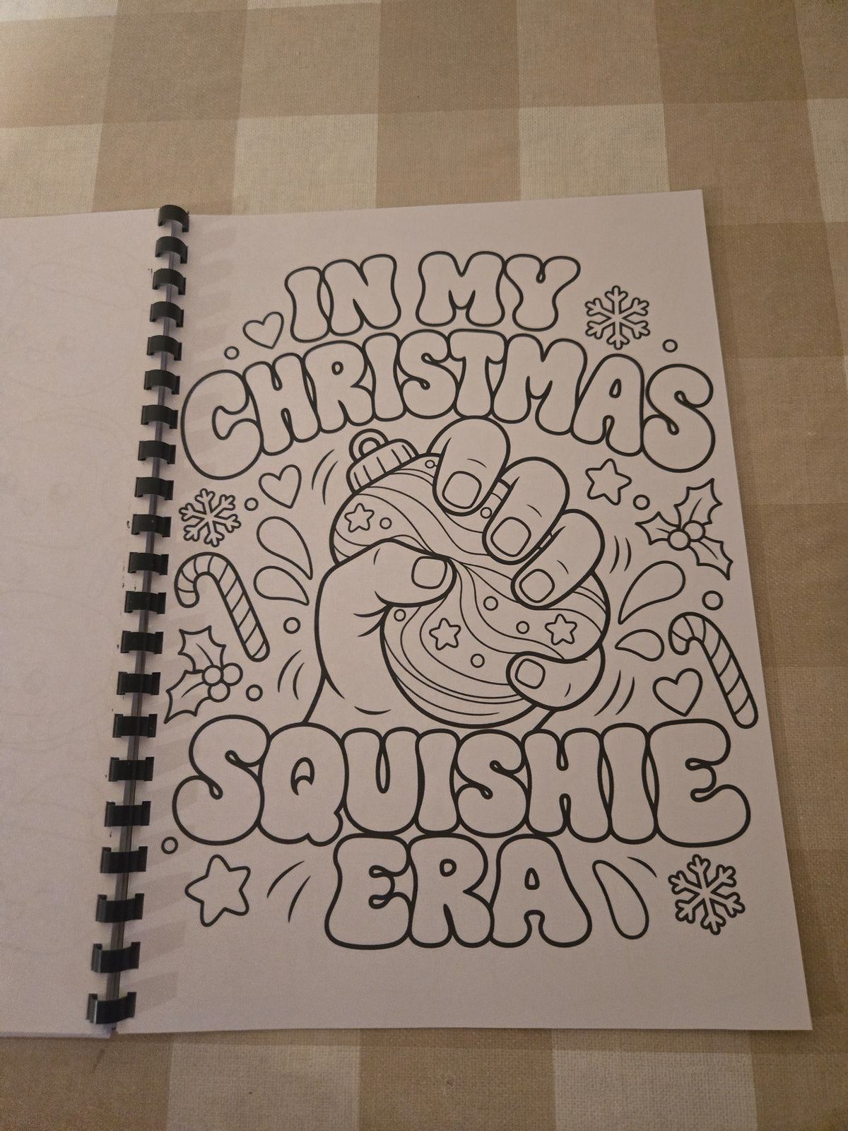 Christmas Squishie colouring book hand squishing festive ornament page