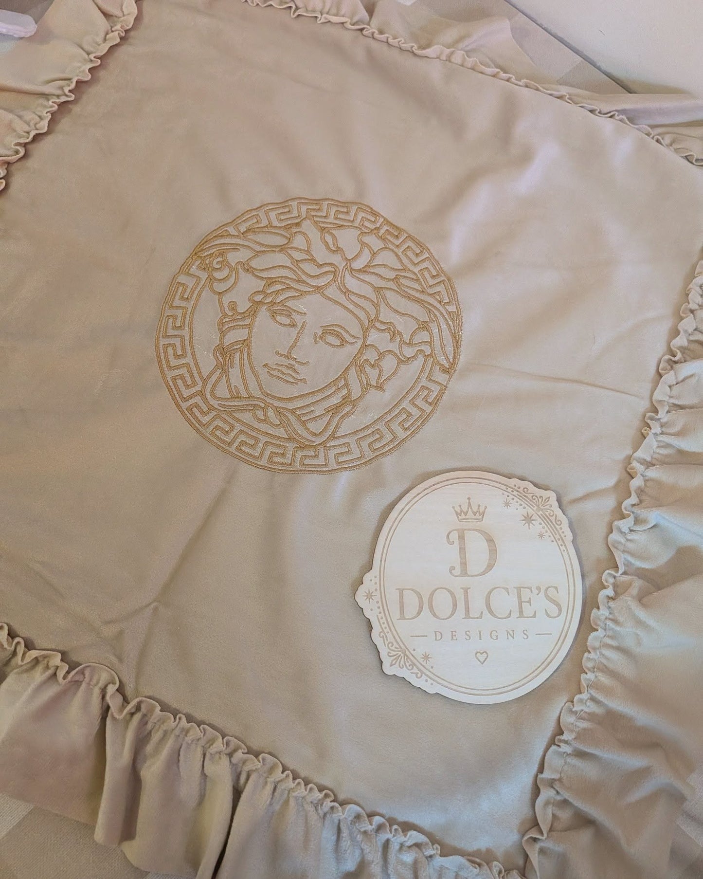 Luxury Gold Emblem Ruffle Cushion Cover – Neutral Embroidered Design