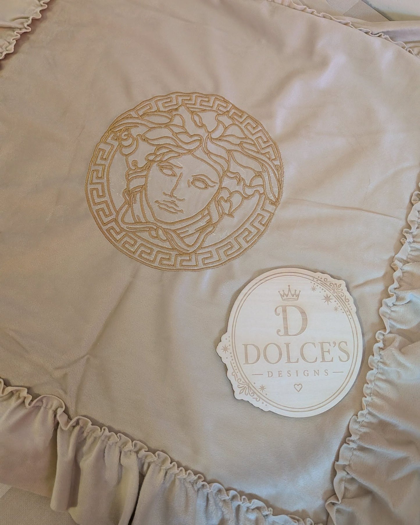 Luxury Gold Emblem Ruffle Cushion Cover – Neutral Embroidered Design