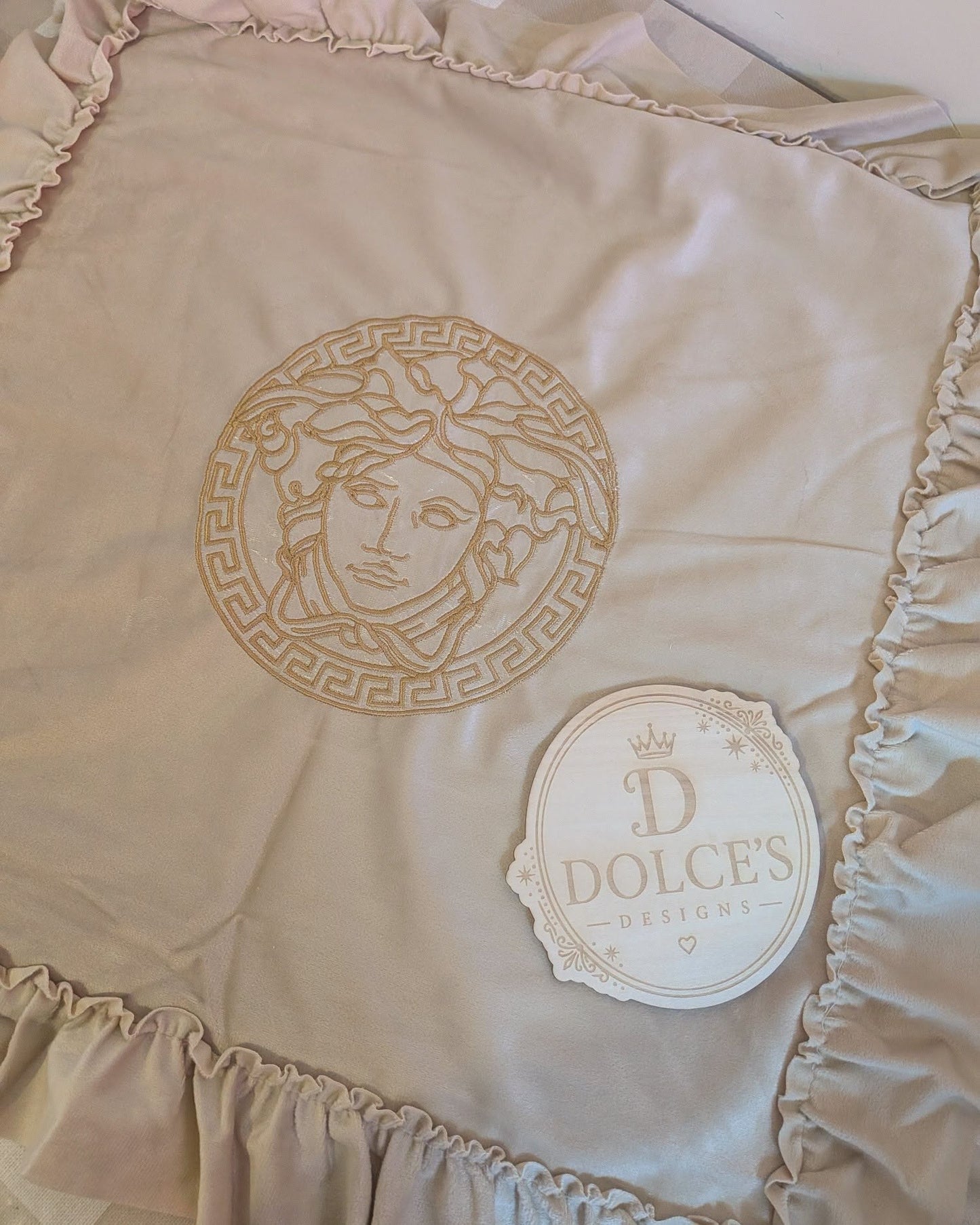 Luxury Gold Emblem Ruffle Cushion Cover – Neutral Embroidered Design